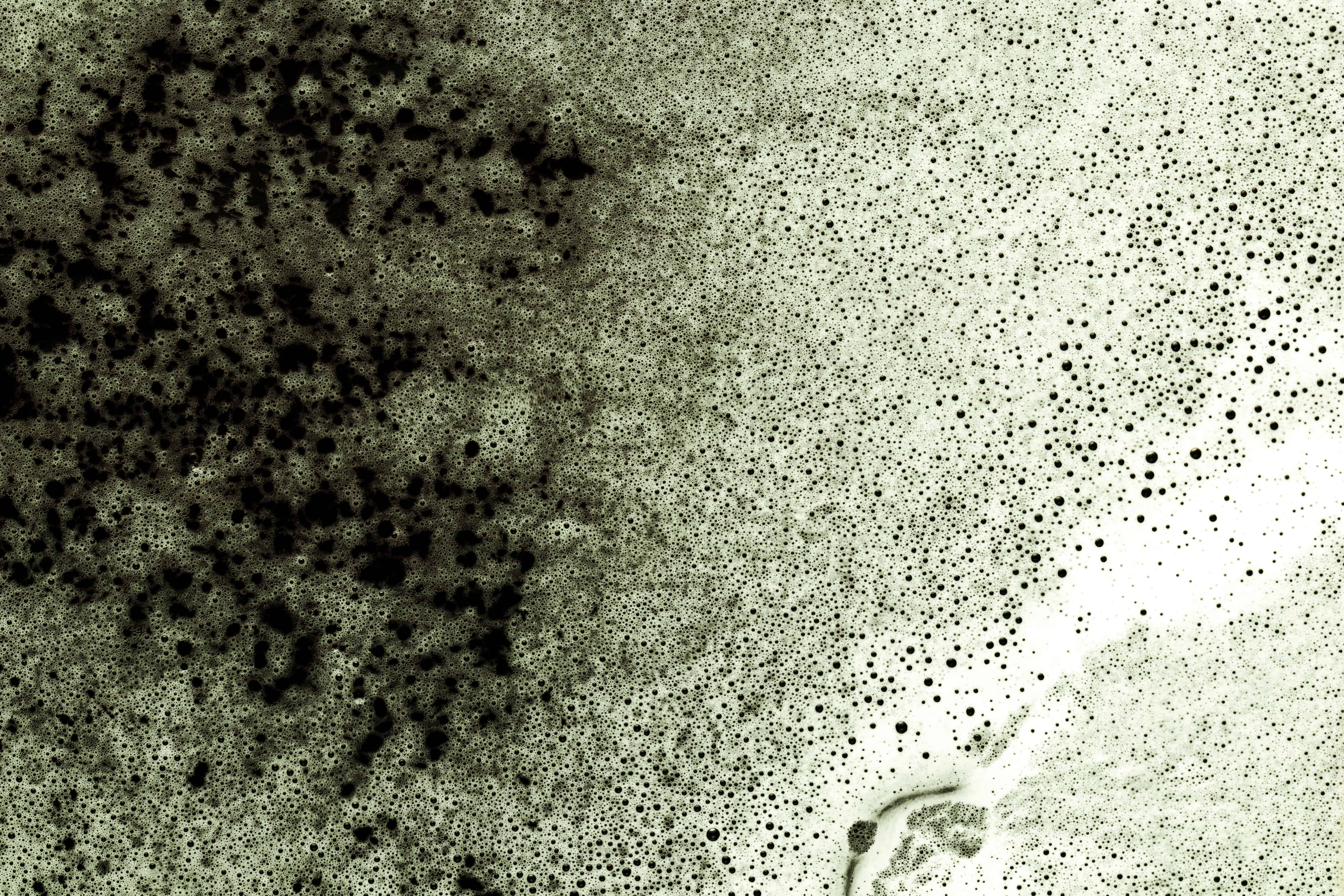 black-liquid-showing-through-foam (1)